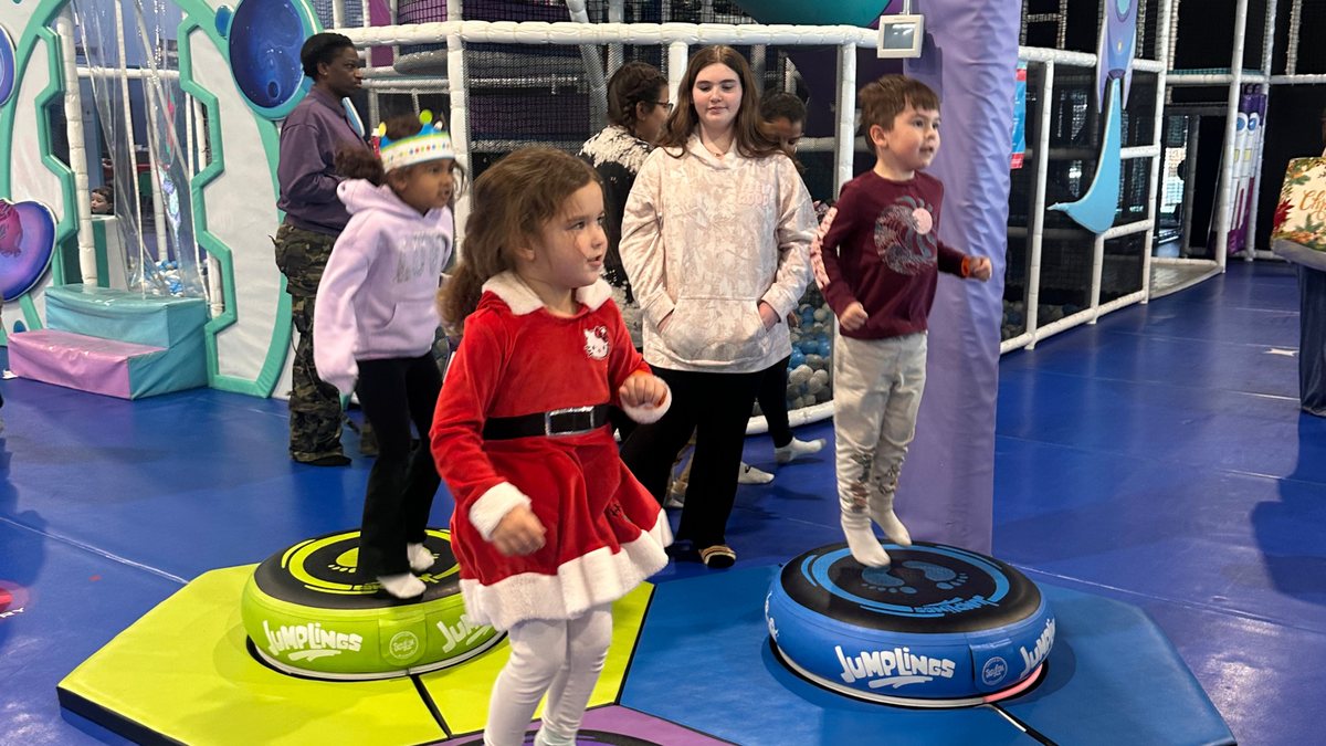 Children playing together on interactive jump pads at Hyper Kidz Fort Worth