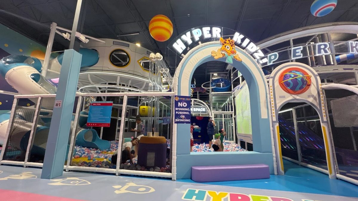 Space-themed play structure and ball pool at Hyper Kidz Fort Worth indoor playground
